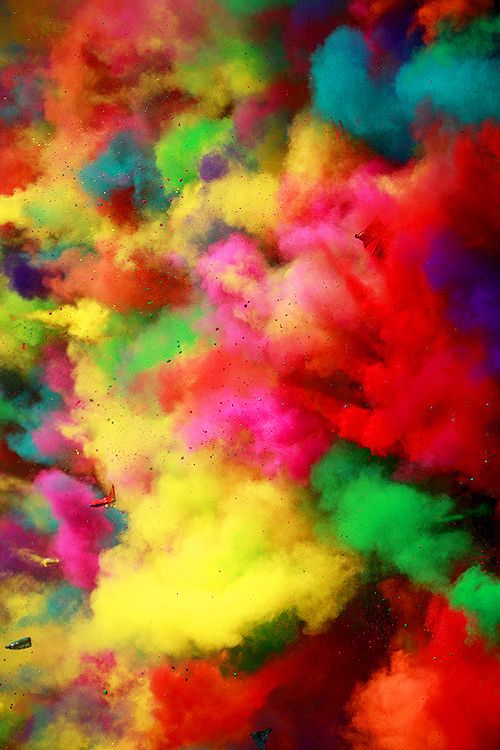 colorful powder is mixed in with each other to create an abstract pattern on the surface