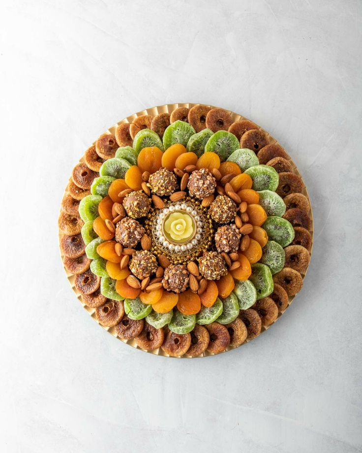 an overhead view of a pastry with nuts in the center