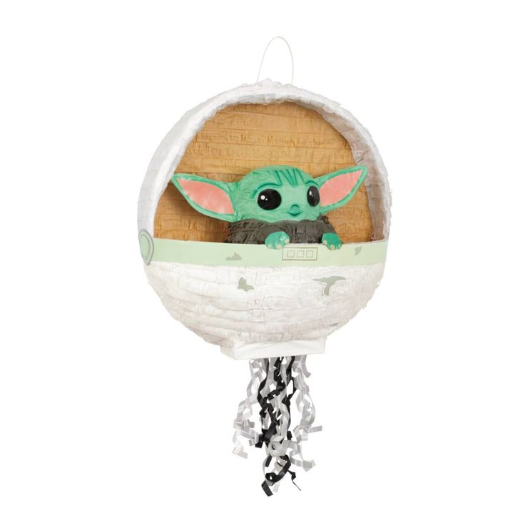 the child yoda plush toy is hanging from a chain on a white background with black and green accents