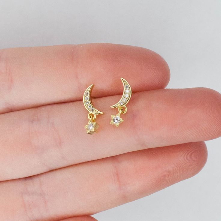 Pair of Star Moon Stud Earrings 925 Sterling Silver 14K Gold cz cubic zirconia * Material: High Quality Solid 925 Sterling Silver  O T H E R ∙ I N F O R M A T I O N * All items are nicely packaged ready to gift in elegant jewelry boxes. * If you can't find the information you need or need some advice for your design? Feel free to contact us. We are fast to reply :) T U R N ∙ A R O U N D ∙ T I M E * This design is ready to ship in 1 - 2 business days. If you have custom made items in your cart, y Gold Celestial Earrings With Diamond Accents, Celestial Gold Earrings With Diamond Accents, Celestial Gold Cubic Zirconia Earrings, Gold Celestial Cubic Zirconia Earrings, Celestial Yellow Gold Cubic Zirconia Earrings, Ethereal Jewelry, Moon Stud Earrings, Moon Studs, Star Moon