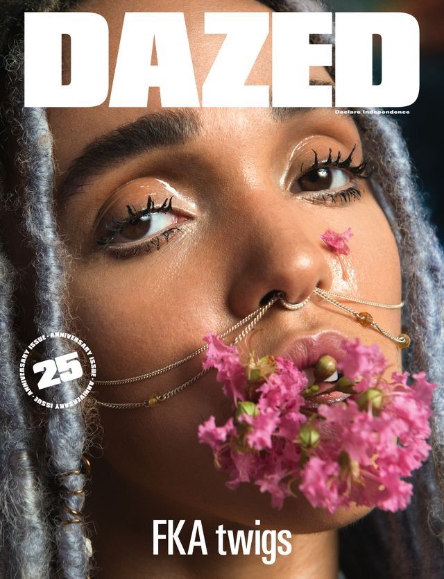 the cover of dazed magazine features a woman with braids and flowers in her mouth