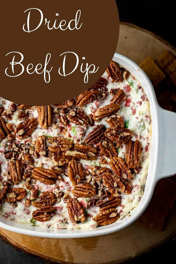 a casserole dish with pecans in it and the words dried beef dip on top