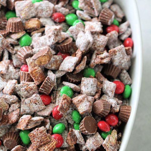 a white bowl filled with chocolate and candy