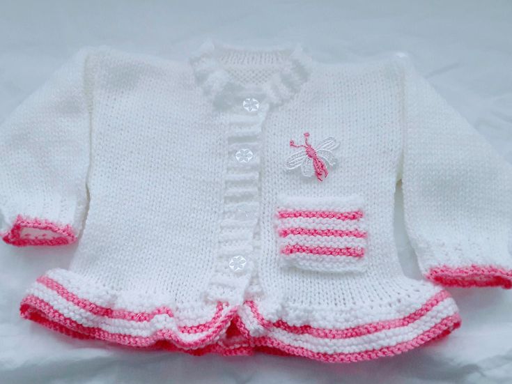 cute knitted baby girls cardigan is the perfect little girls outfit, it matches perfectly with all your other baby clothes, jeans, dresses & leggings and has been a very popular choice  This knitted baby girl Jacket also makes a great gift for new moms, a beautiful coming home baby outfit or to give as a baby shower gift Girls holiday sweater, Girls Christmas sweater or Little girl wedding clothes All my baby knitwear is hand knitted in soft acrylic baby yarn the main colour is silver and you ca Cute Fitted White Sweater, White Fitted Cute Sweater, Fitted Cream Cute Sweater, Cute Fitted Cream Sweater, Cute White Knitted Outerwear, Cute Fitted Cardigan For Autumn, Hand Knitted Long Sleeve Pink Tops, Cute Fitted Fall Cardigan, Pink Hand Knitted Long Sleeve Tops