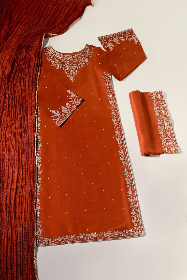 Meticulously crafted from a remarkably glamourous shade of burnt orange ( pure raw silk 60 gms )“ Minaree “ with its intricate zari details strikes the perfect balance between elegant and eye-catching, making this beautiful design a must have. The length of the long kameez is 46 inches.Agha Noor’s style tip - “ Style w Long Kameez, Agha Noor, Sleek Bun, Raw Silk, Burnt Orange, Stones And Crystals, Beautiful Design, Must Haves, Silk