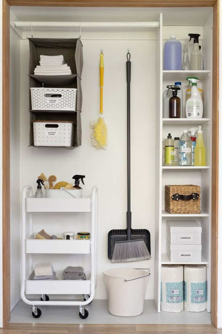 a white shelf filled with lots of cleaning supplies