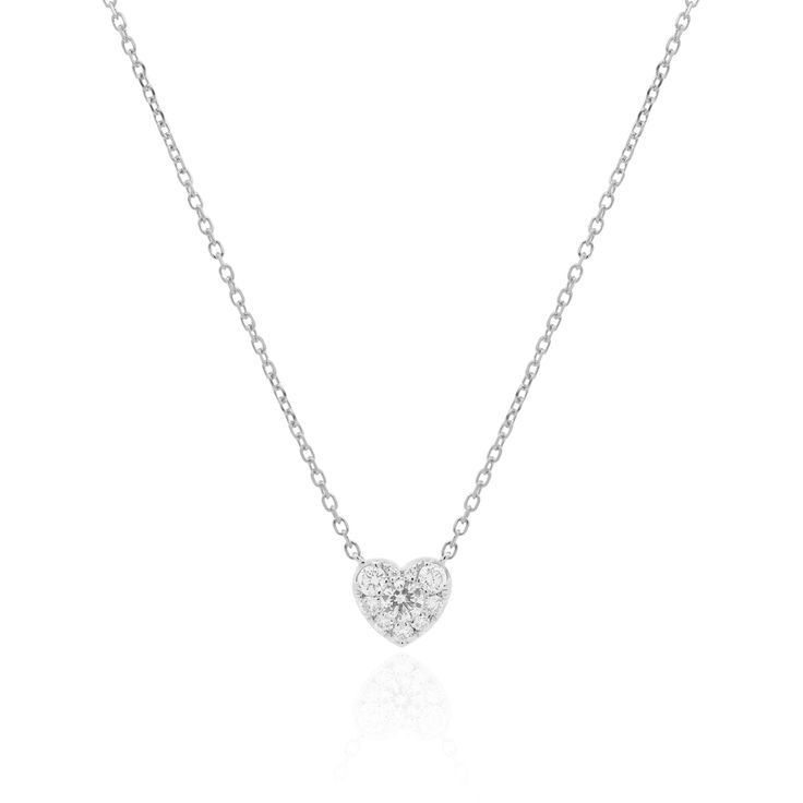 Add an elegant touch to your neck look with our new Pave Diamond Heart Necklace, featuring a round diamond surrounded by several graduating round diamonds for the ultimate illusion of a sparkling heart! 18K White Gold1 Round Brilliant White Diamond at 0.11 Carats 9 Round Brilliant White Diamonds at 0.14 Carats Total WeightHeart Measures: 6 millimeters Adjustable Chain Length: 16-17-18 inches Lobster Clasp// Classic Heart Solitaire Necklace With Diamond Accents, Classic Brilliant Cut Heart Necklace For Valentine's Day, Formal Cubic Zirconia Diamond Necklace With Heart Charm, Diamond Heart Necklace For Wedding, Classic Diamond Heart Necklace For Formal Occasions, Classic Valentine's Day Heart Necklace With Brilliant Cut, Classic Heart Shaped Necklace With Single Cut Diamonds, Diamond Heart Charm Necklaces With Round Cut, Diamond Necklaces With Heart Charm And Round Cut