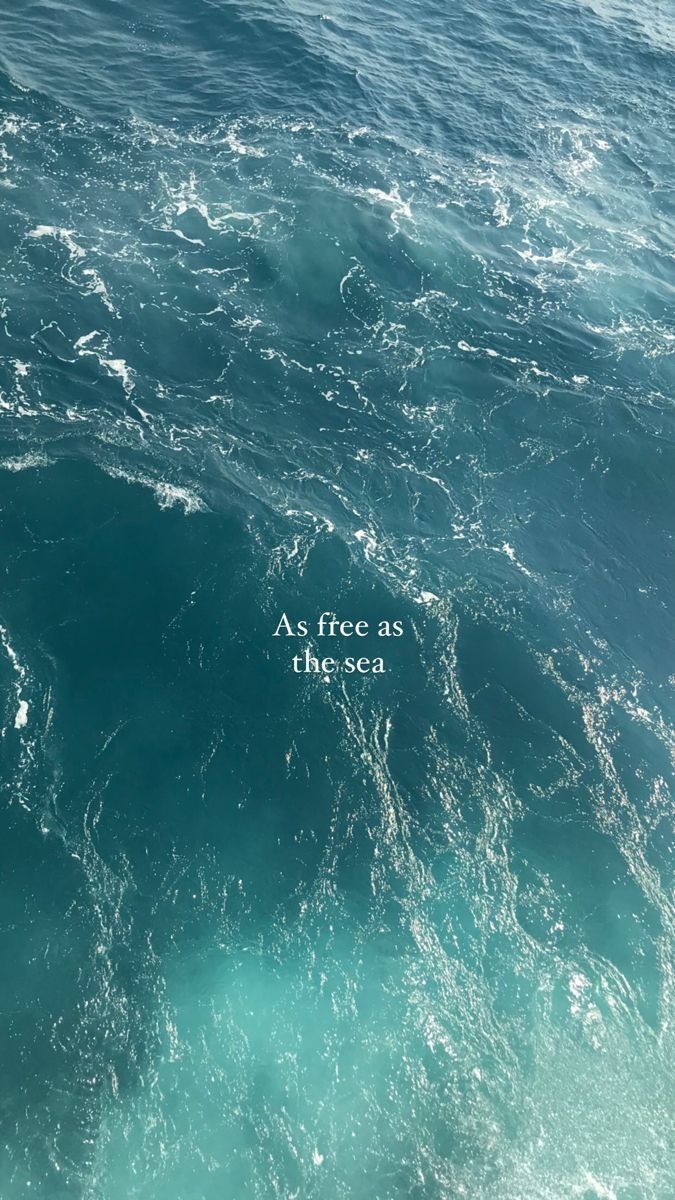 an ocean with the words as free as the sea