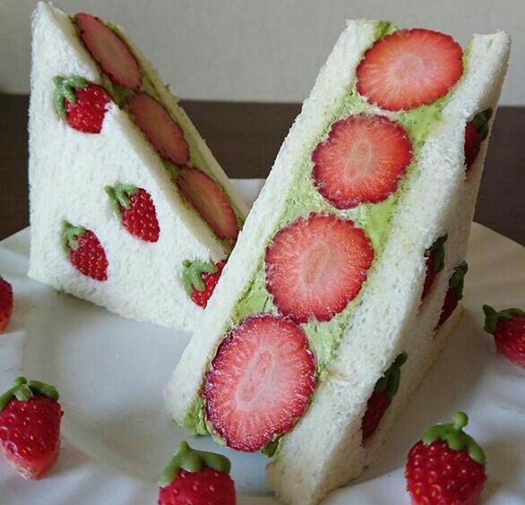 there is a cake with strawberries on it