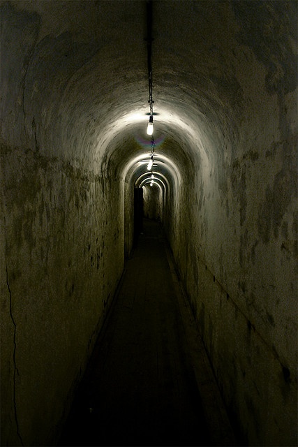 a dark tunnel with light at the end