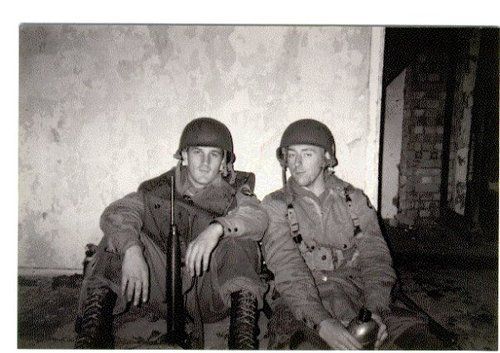 two men in uniforms sitting next to each other