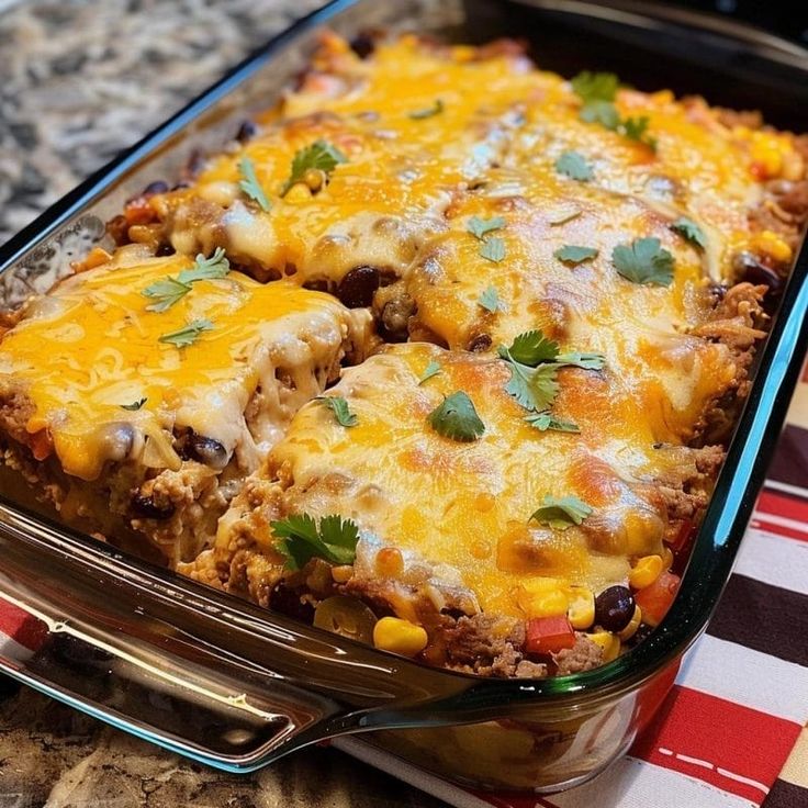 a casserole dish filled with meat and vegetables