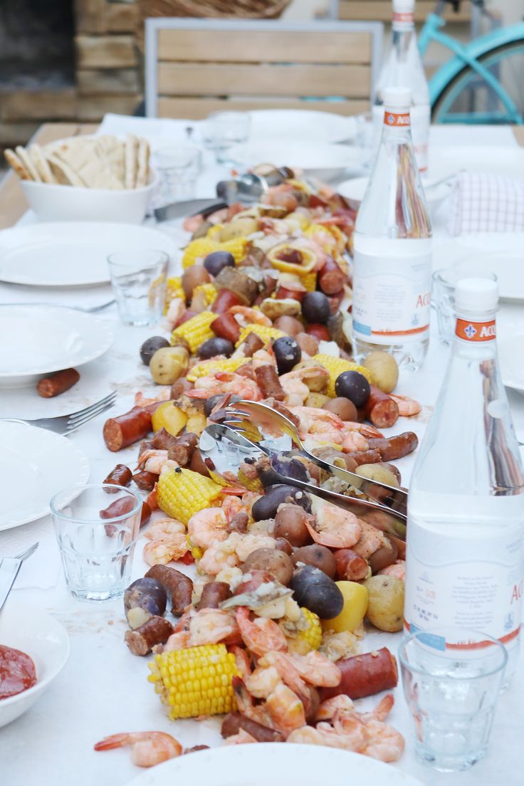 a long table is set with food and water