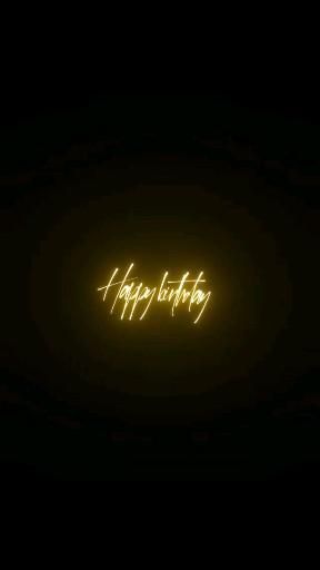 the words happy birthday are lit up in the dark