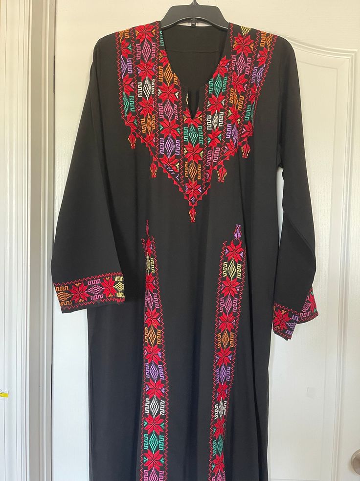 This is a Vintage Style Egyptian Arabic Bedouin Galabeya Abaya Kafatan Dress Hand Embroidered with Colorful Gorgeous Canvas all over it   Look at the Stunning Bedouin Tribal WorkLovely Handmade and crafted of Siwa Egypt. This Abaya dress is in never worn new condition.    Also i'm listing it's Matching Face Veil with Coins and scarf,  if you would like to take a look!   Its length : 54.5" -Around Hip : 27 inches, Bust 24.5 inches, Sleeves 23 inchesapproximately I believe it can fit size L : XL      Amazing it's a piece of Artyou will be impressed by it's Stunning colorful stitches and Bedouin Style.   Very nice Ethnic Bedouin Egyptian costume!     Please check the photos for more detailsBeautiful Handmade colorful Stitches.   Please, feel free to ask any questions before purchasing. ALL IT Egyptian Abaya, Siwa Egypt, Egyptian Fabric, Egyptian Arabic, Face Veil, Abaya Dress, Dress Handmade, Spring Hill, Mode Vintage