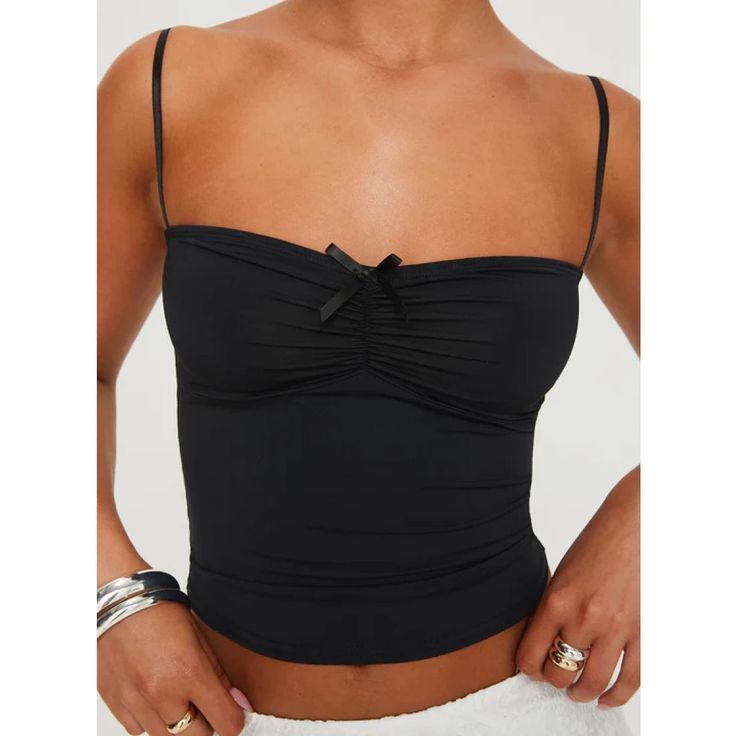 Step into summer with a splash of Y2K nostalgia in our Ruched Spaghetti Strap Camisole. This stylish piece combines vintage flair with modern fashion, making it a must-have for your warm-weather wardrobe. Whether you're catching up with friends at a café or dancing the night away at a beach party, this top will keep you looking chic and feeling comfortable. Key Features Elasticity: Medium stretch for a flattering fit that moves with you Fabric: High-quality broadcloth that's both durable and bre Y2k Tank Top With Built-in Bra For Summer, Black Summer Tops With Built-in Bra, Summer Camisole With Built-in Bra And Tank Straps, Y2k Summer Camisole With Spaghetti Straps, Y2k Style Summer Camisole With Spaghetti Straps, Y2k Style Spaghetti Strap Camisole For Summer, Y2k Camisole With Spaghetti Straps For Summer, Summer Party Camisole Tank Top, Y2k Style Summer Camisole With Straps