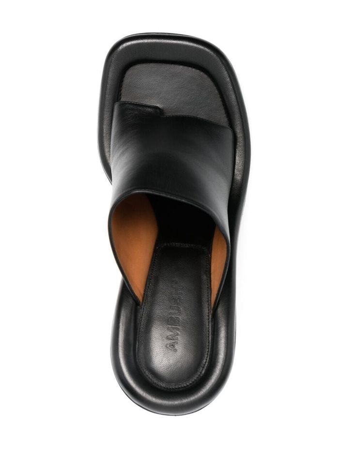 Luxury Synthetic Mules For Spring, Luxury Padded Heel Slip-on Slides, Luxury Suede Slip-on Mules, Luxury Textured Sole Slip-on Mules, Luxury Brown Mules With Cushioned Footbed, Luxury Slip-on Mules With Open Heel, Luxury Black Slippers With Branded Insole, Luxury Fitted Square Toe Sandals, Luxury Casual Synthetic Mules