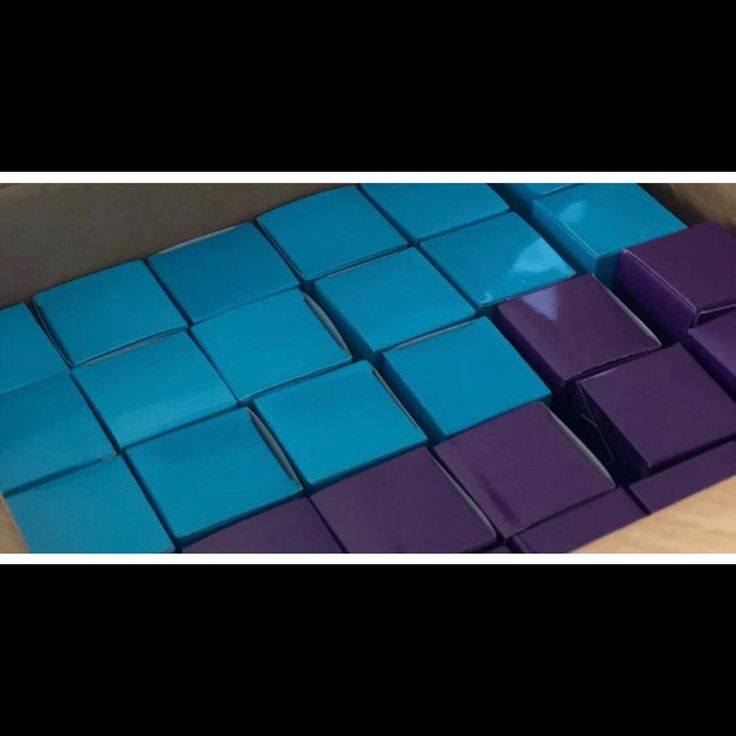 some purple and blue tiles on a table