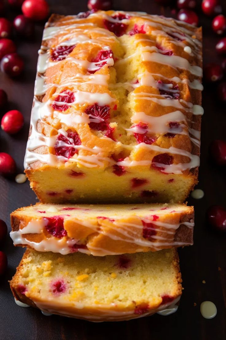 cranberry orange pound cake with icing and fresh cranberries on the side