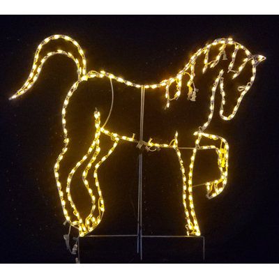 a lighted horse is shown on a pole