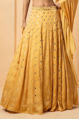 Gold attached cancan lehenga with mirror, bead, pearl embellishment. Paired with halter neck embellished padded blouse and dupatta. - Aza Fashions Sleeveless Party Dress With Gota Work, Festive Floor-length Embellished Skirt, Embellished Floor-length Festive Skirt, Designer Yellow Sequin Sets, Festive Anarkali Embellished Skirt, Embellished Skirt For Reception And Festive Occasions, Embellished Skirt For Festive Reception, Festive Embellished Skirt For Reception, Yellow Embellished Choli For Eid