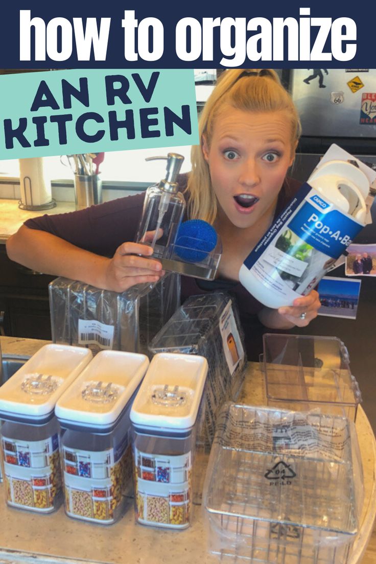 a woman is holding up an rv kitchen kit and making it look like she's surprised