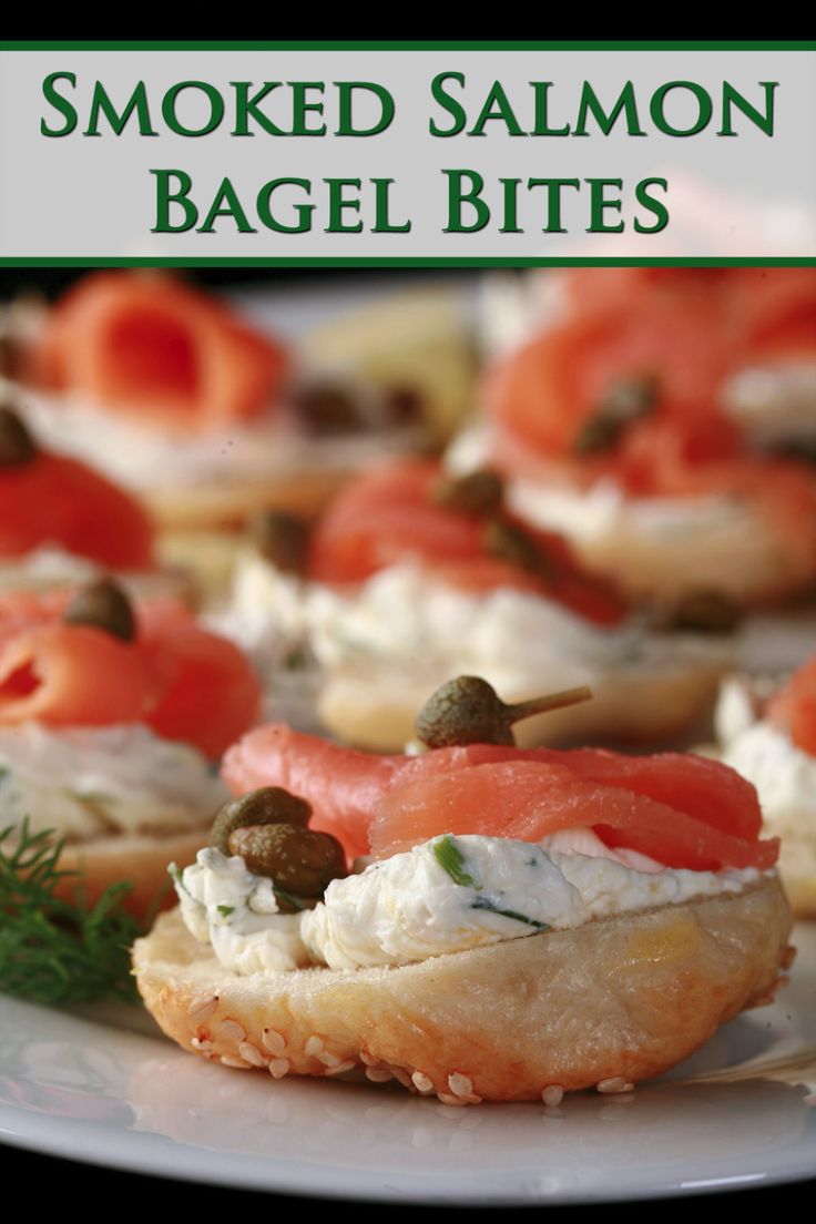 A plate of smoked salmon bagel bites - mini bagels with seasoned cream cheese and smoked salmon on top. Smoked Salmon Bagel Bites, Smoked Salmon Mini Bagel, Mini Bagels With Smoked Salmon, Mini Lox Bagels, Mini Bagels Appetizers, Mini Lox And Bagels, Mini Bagel Ideas, Salmon Bagels Smoked, Smoked Salmon And Bagels