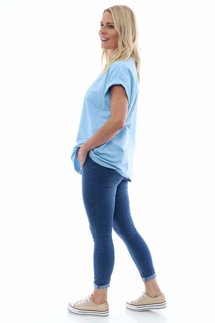 The wardrobe essential you need! The Made in Italy Rebecca Rolled Sleeve Top is a stunning flattering shape that will be your go-to piece all year round. Pair with jeans or shorts and trainers or sandals. Style with our Delara Shorts for the perfect summer style. - Rolled back sleeves - Round neckline - Ribbed detailing Stretch Tops In Medium Wash For Everyday, Stretch Medium Wash Tops For Everyday, Stretch Tops For Everyday Use, Basic Blue Bottoms For Everyday, Basic Blue Bottoms For Everyday Wear, Casual Washed Blue Stretch Tops, Basic Blue Relaxed Fit Bottoms, Light Wash Stretch Casual Tops, Sporty Relaxed Fit Blue Jeans