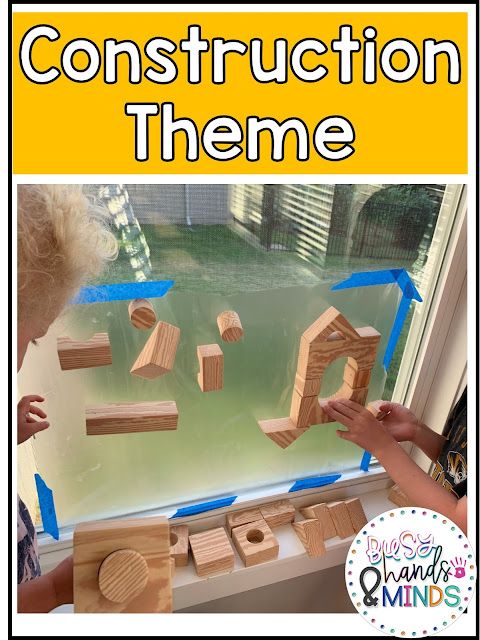 the construction theme is displayed in front of a window with blue tape and wooden blocks