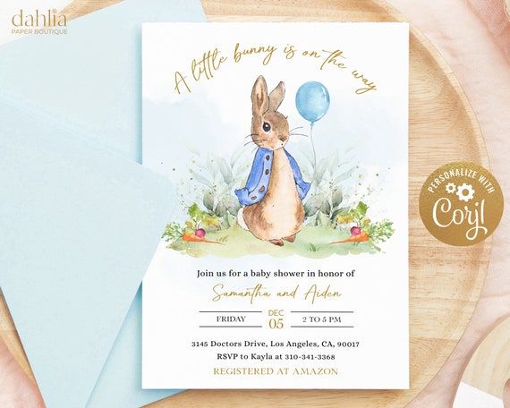 a little bunny is in the way birthday party card with envelope and blue paper on a wooden table