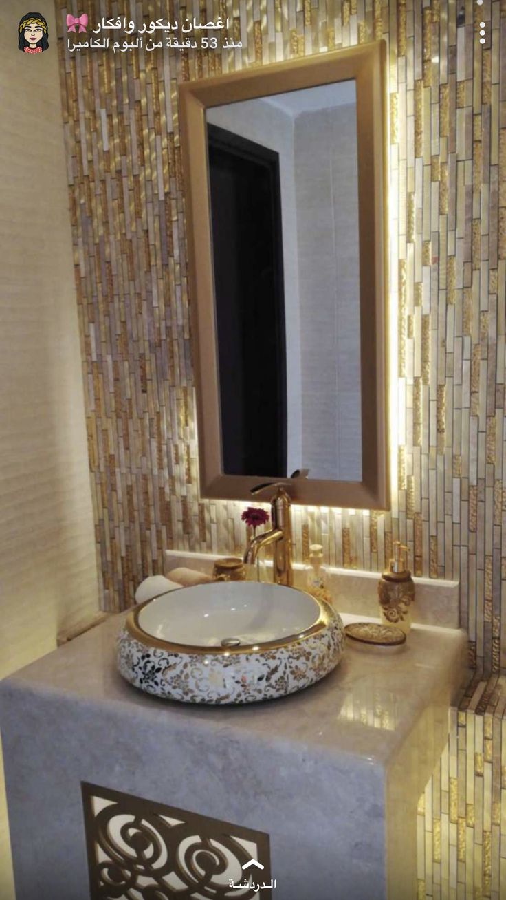 a bathroom sink sitting under a mirror next to a counter