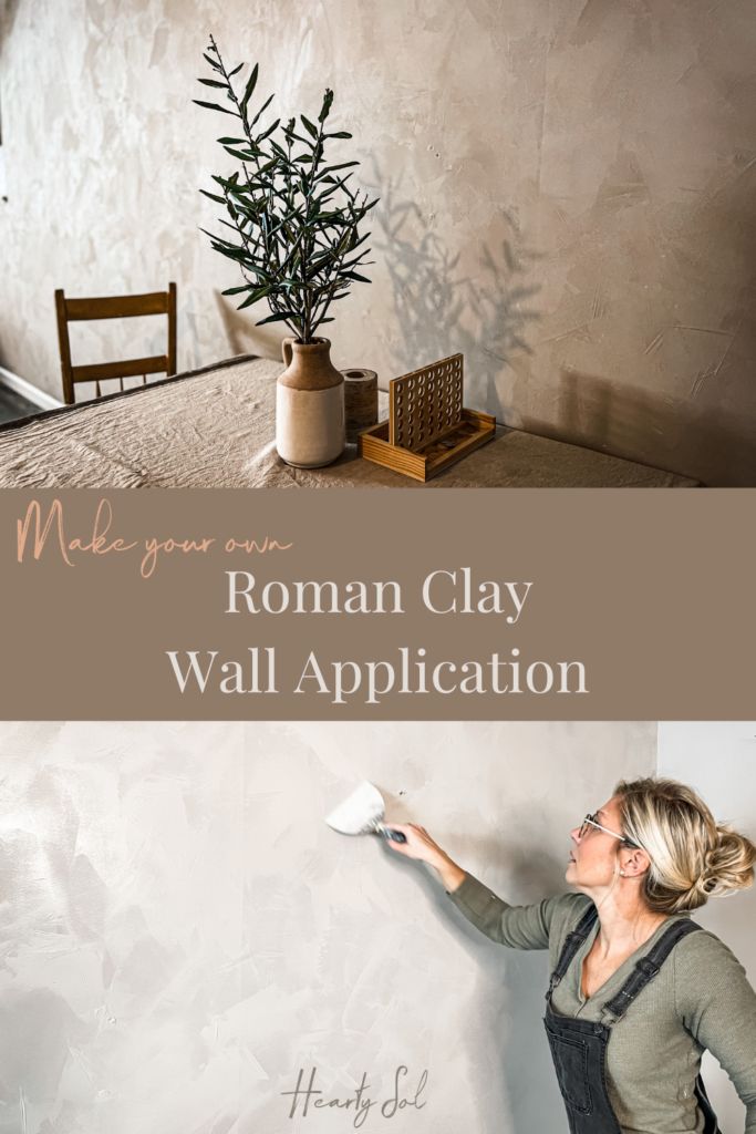 a woman is painting a wall with white paint and she has her hand on the side of the wall