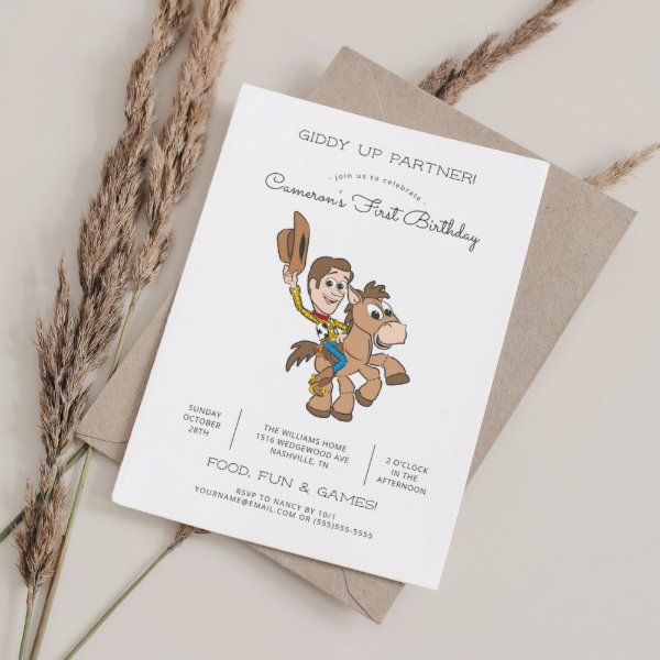 a card with an image of a cartoon character on it next to some dried grass