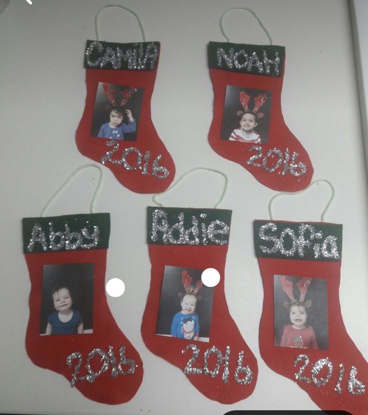 four christmas stockings hanging on a wall