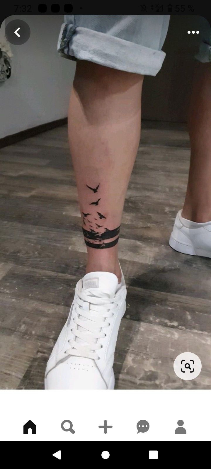 a person with a bird tattoo on their leg