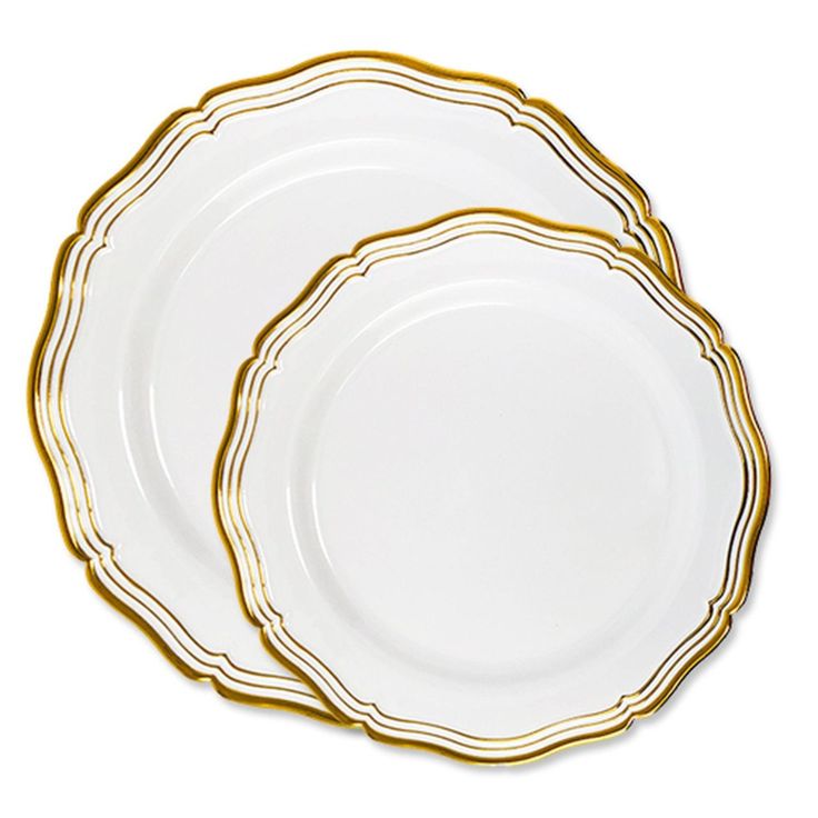 three white and gold plates on a white background