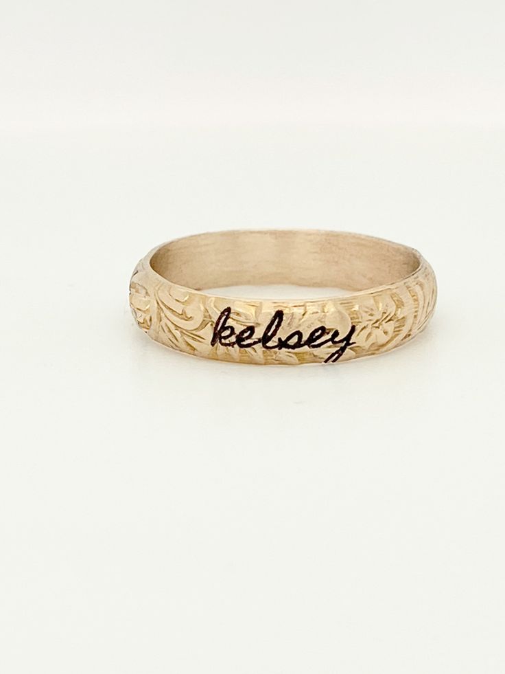 The Blume Ring This floral stacking ring is available in 14k yellow gold filled OR 14k solid gold and makes a perfect gift for yourself, wife, mom, or loved one!This listing is for ONE ring. This stacking ring features a floral pattern wrapped around the entire band. Combine it with a personalized ring for a cute, everyday look! Personalized Engraved 14k Gold Ring, Elegant Promise Rings With Hand Stamping, Hand Stamped 14k Gold Engraved Ring, Elegant Hand Stamped Promise Rings, 14k Yellow Gold Hand Stamped Engraved Ring, 14k Yellow Gold Engraved Ring With Hand Stamped Details, Hand Stamped 14k Yellow Gold Engraved Ring, Sterling Silver Engraved Ring Stamped 14k For Promise, Heirloom Rose Gold Stackable Rings Stamped 14k