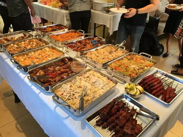 many trays of food are on a table