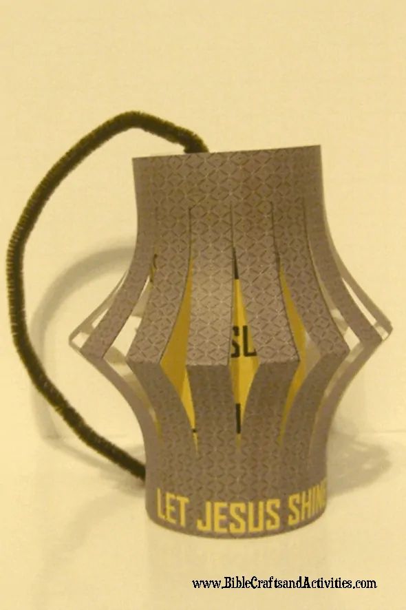 an origami lantern with the word let jesus shine printed on it's side