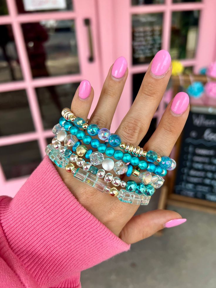 Add a pop of color with our vibrant blue Fairy Stack Bracelet! Perfect for a playful touch to any outfit. Stack 'em up and make a statement. Choose to purchase the full stack or an individual bracelet. 1 bracelet for $9 or 5 for $38 - Discount Applied at Checkout Lead & Nickel Free Bracelets are 'one size fits most' and are designed to fit wrists up to 7.5" comfortably. Please be aware that due to the unique and handmade nature of each product, colors, shapes, and bead sizes may vary slightly fr Trendy Turquoise Stackable Beaded Bracelets, Trendy Blue Stackable Stretch Bracelet, Blue Crystal Bracelet With Stackable Round Beads, Blue Stackable Stretch Bracelet, Adjustable Stacked Blue Bracelets, Blue Adjustable Charm Bracelet For Party, Adjustable Blue Charm Bracelet For Party, Adjustable Blue Charm Bracelet For Parties, Stackable Blue Stretch Bracelet