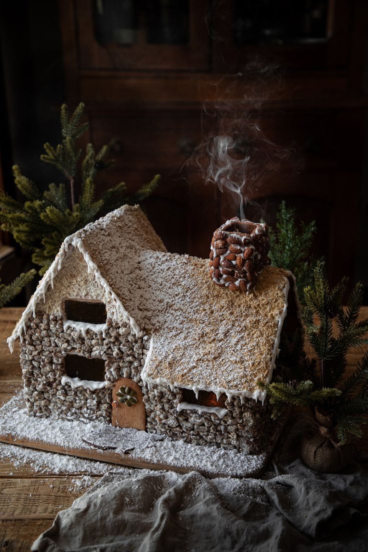 a small house made out of cookies and marshmallows