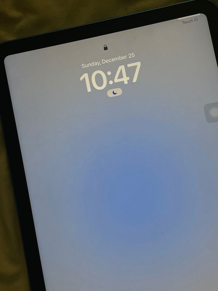 an ipad with the time displayed on it