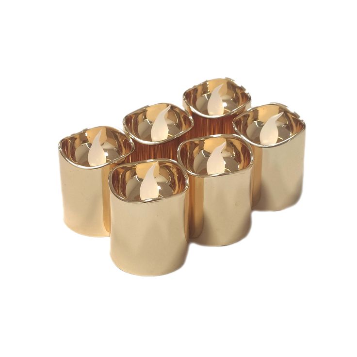 six gold metal cups sitting next to each other