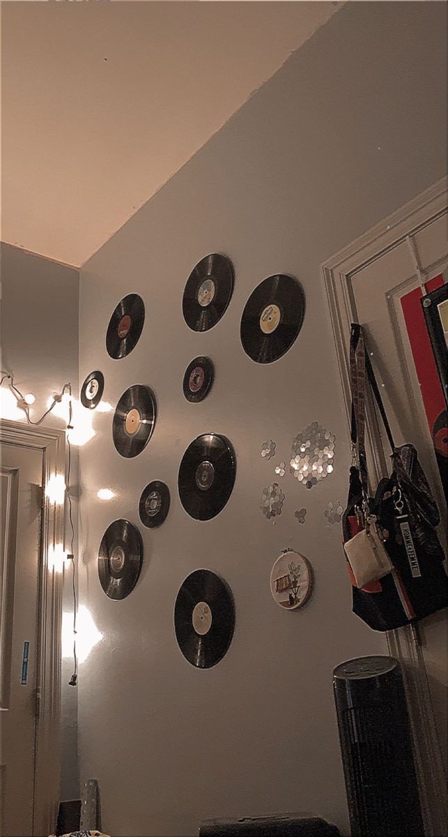 there are many records hanging on the wall