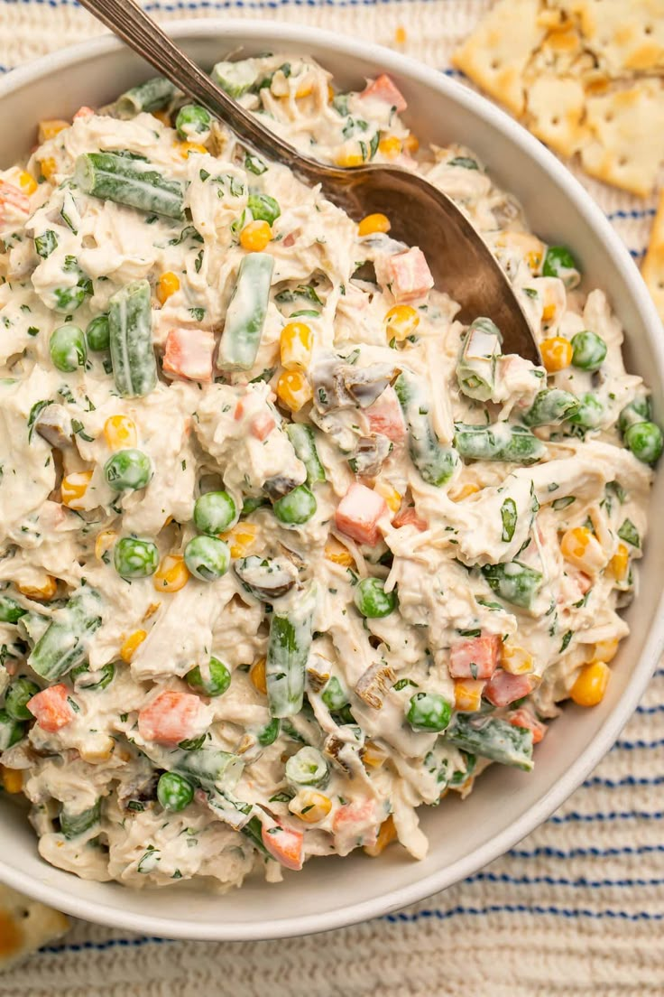 Mexican chicken salad is tender shredded chicken tossed in a creamy sauce with mixed veggies, fresh cilantro, and jalapeños… Tons of flavor! One of my favorites from my time in Texas and California, this is a great dish to serve at any potluck, cookout, or BBQ and will be gone in no time. Delicious on tostadas, with saltines for dipping, as a sandwich, or even eaten straight with a fork!