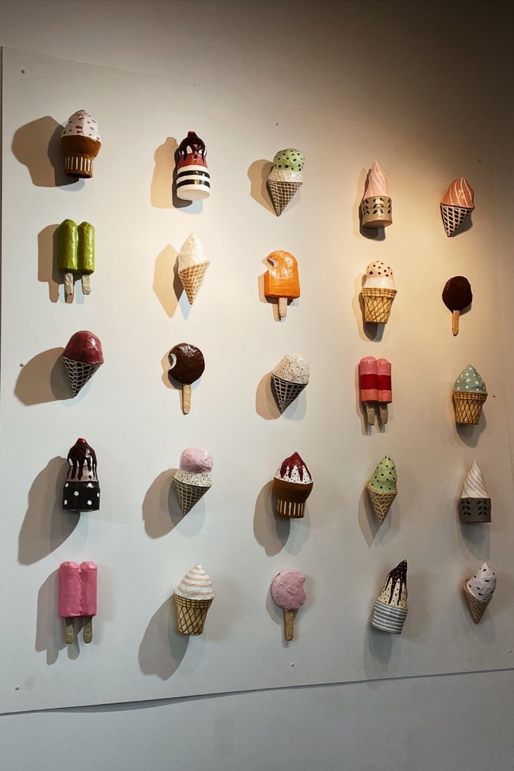 there are many ice cream cones on the wall