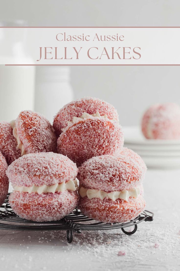 powdered sugar covered jelly cakes sitting on a wire rack with the words classic aussie jelly cakes above it