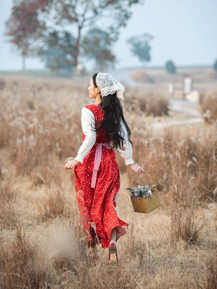 Escape from the hustle and bustle of city life and turn back time as a traditional lady enjoying the freeness of nature. This faux two-piece dress features a square neckline with long puff sleeves and vibrant pinafore with ditsy florals and gingham trims. Full maxi length skirt for running in the wind and twirling around. Comes with a matching gingham apron that ties at the waist and lace headscarf. S: 14.5" across shoulders, 33" chest, 26" waist, 49" lengthM: 15" across shoulders, 34.5" chest, 27.5" waist, 49" lengthL: 15.5" across shoulders, 36" chest, 29" waist, 49.5" lengthXL: 16" across shoulders, 37.5" chest, 30.5" waist, 49.5" length Lace Headscarf, Gingham Apron, Turn Back Time, Folk Dress, Folk Dresses, Prairie Dress, Long Puff Sleeves, Overall Dress, Sweater Blouse