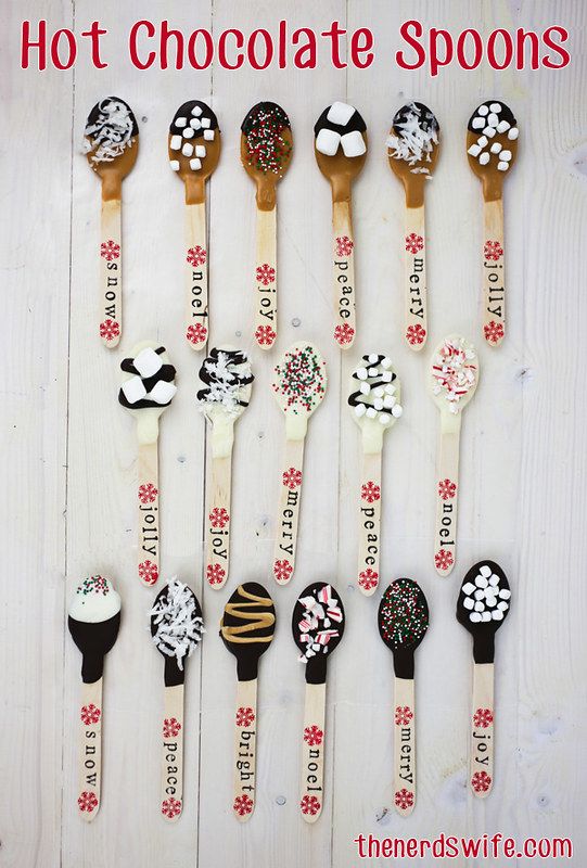 there are many spoons that have chocolate spoons on them with words written on them