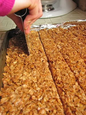 a person cutting up food on top of a counter